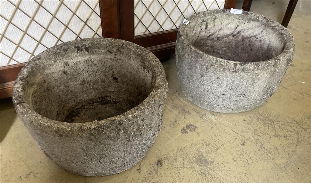 A pair of reconstituted stone circular garden planters, diameter 47cm, height 28cm